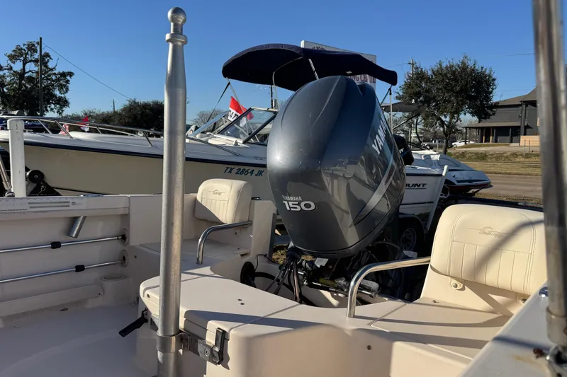 Slide: The Image of 2006 Grady-White Tournament 185 boat with Yamaha 150 engine, parked outdoors. - 6