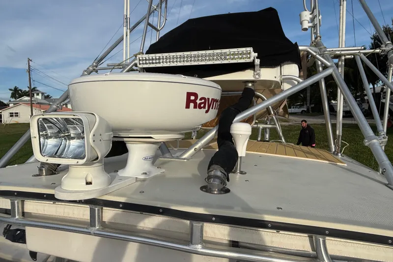 Slide: The Image of 2003 Carolina Classic 28 boat with radar and spotlight on deck. - 19