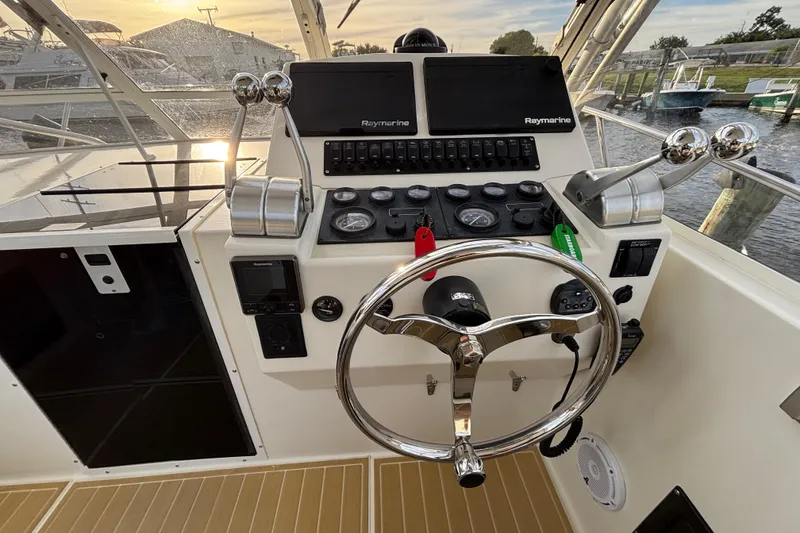 Slide: The Image of Control panel of a 2003 Carolina Classic 28 boat with Raymarine electronics. - 28
