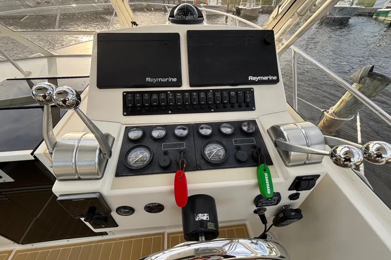 Slide: The Image of Control panel of a 2003 Carolina Classic 28 boat with Raymarine navigation equipment. - 29