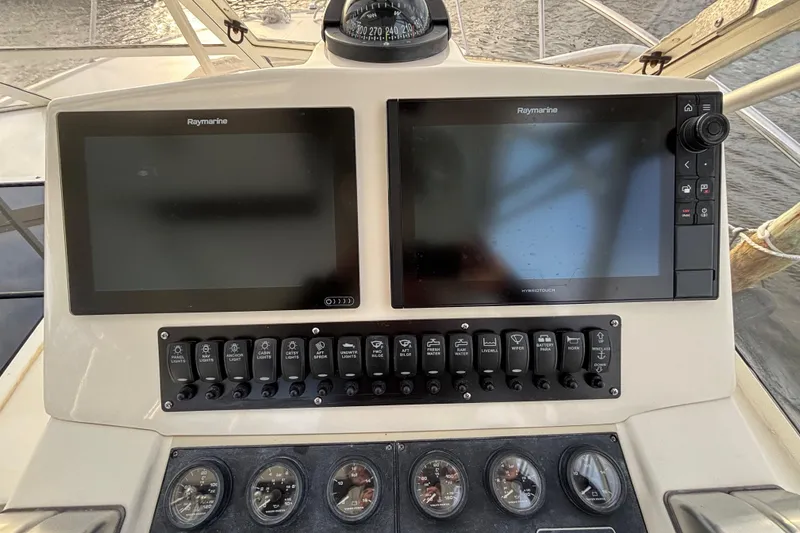 Slide: The Image of Control panel of a 2003 Carolina Classic 28 boat with Raymarine displays. - 30