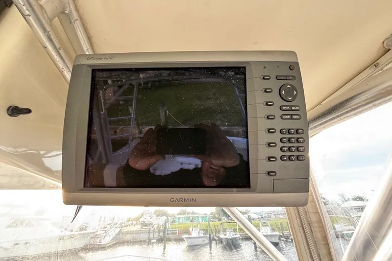 Slide: The Image of Garmin GPSmap 4212 on 2003 Carolina Classic 28 boat dashboard. - 32