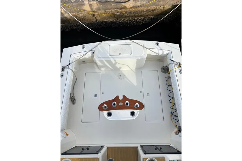 Slide: The Image of Deck of a 2003 Carolina Classic 28 boat, clean and well-maintained. - 41