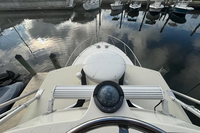 Slide: The Image of 2003 Carolina Classic 28 boat docked at marina. - 47