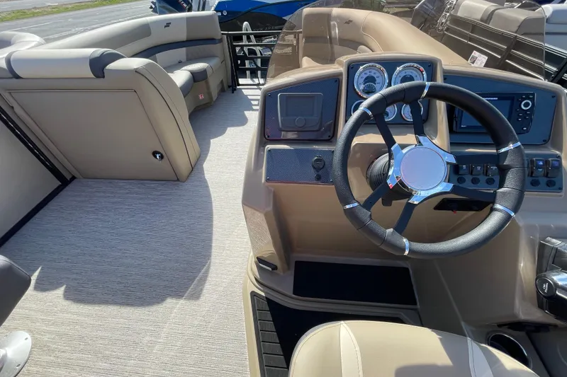 Slide: The Image of 2026 Starcraft EXS 3 R boat interior with steering wheel and dashboard controls. - 4