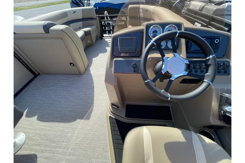 Slide: The Image of 2026 Starcraft EXS 3 R boat interior with steering wheel and dashboard controls. - 5