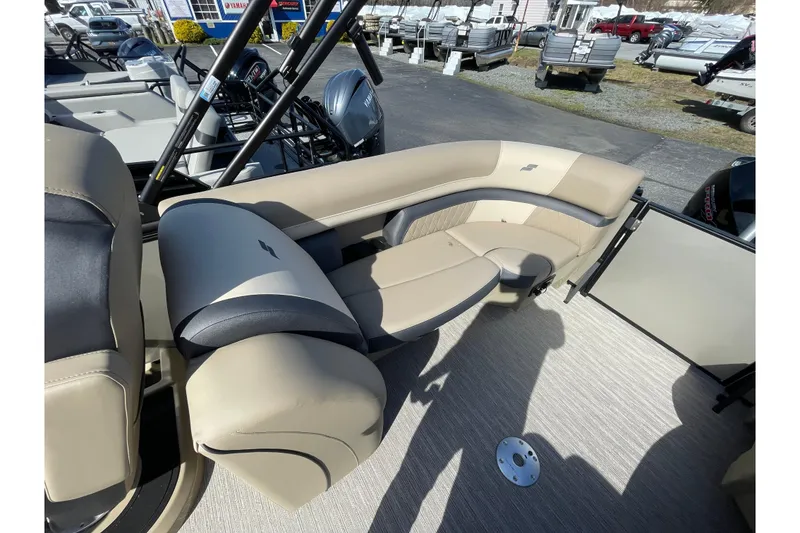 Slide: The Image of 2026 Starcraft EXS 3 R boat interior with beige seating and modern design. - 7