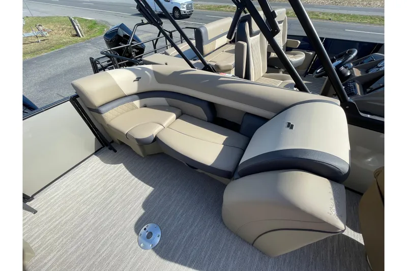 Slide: The Image of Luxurious seating on 2026 Starcraft EXS 3 R boat, featuring beige and black upholstery. - 8
