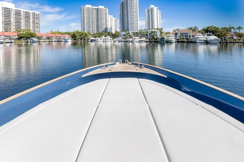 Slide: The Image of 2021 Solaris Power 48 OPEN yacht in a marina with city skyline backdrop. - 12