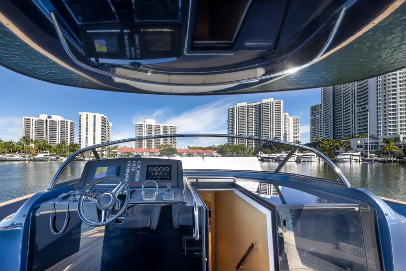 Slide: The Image of Cockpit view of 2021 Solaris Power 48 OPEN yacht with city skyline backdrop. - 16