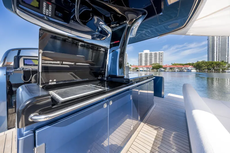 Slide: The Image of 2021 Solaris Power 48 OPEN yacht with sleek outdoor kitchen and waterfront view. - 19