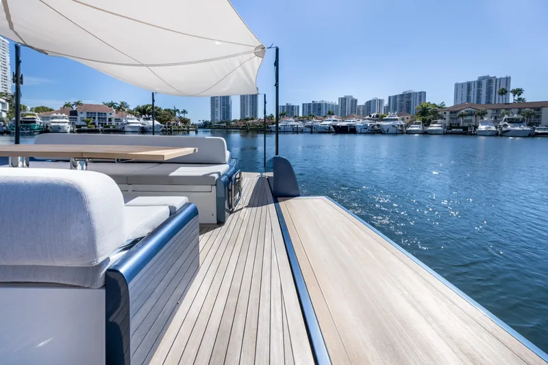 Slide: The Image of 2021 Solaris Power 48 OPEN yacht with elegant deck, city skyline, and waterfront view. - 24
