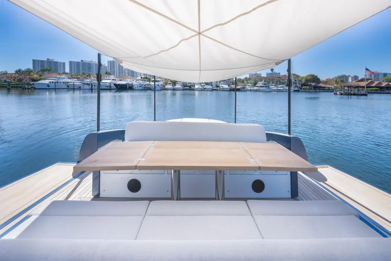Slide: The Image of 2021 Solaris Power 48 OPEN yacht with shaded deck and waterfront view. - 25