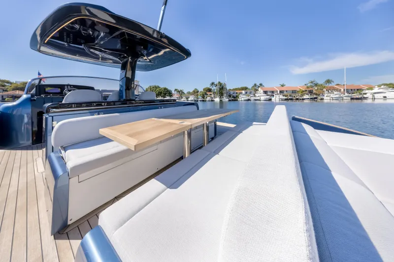 Slide: The Image of 2021 Solaris Power 48 OPEN yacht with sleek deck and luxurious seating by the water. - 27