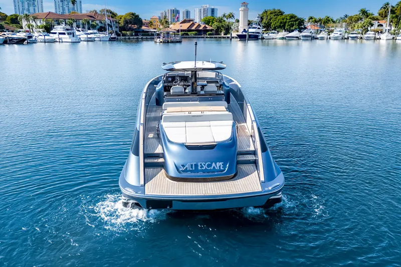 Slide: The Image of 2021 Solaris Power 48 OPEN yacht cruising in a marina with cityscape background. - 3