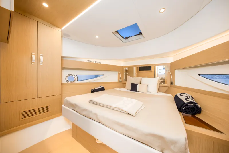 Slide: The Image of Luxurious cabin interior of 2021 Solaris Power 48 OPEN yacht, featuring elegant wood finishes. - 34
