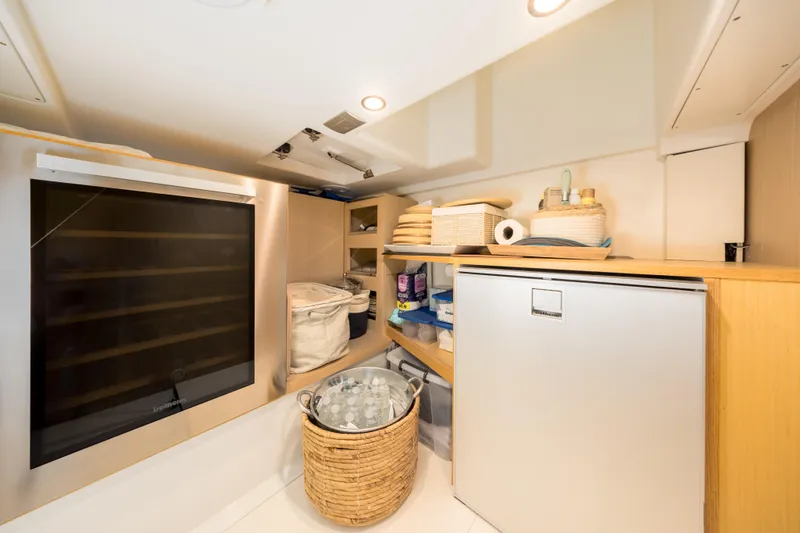Slide: The Image of Interior storage area of 2021 Solaris Power 48 OPEN yacht with shelves and appliances. - 37
