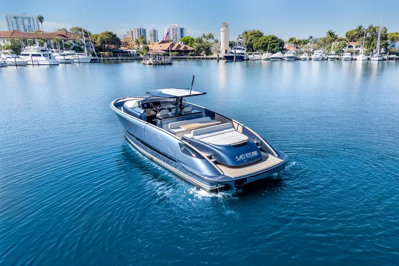 Slide: The Image of 2021 Solaris Power 48 OPEN yacht cruising in a serene marina setting. - 4