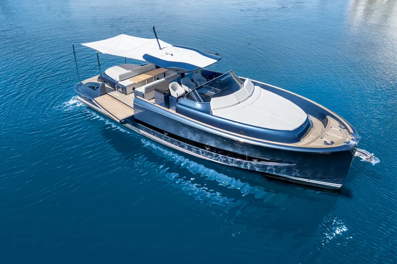 Slide: The Image of 2021 Solaris Power 48 OPEN yacht cruising on clear blue water. - 8