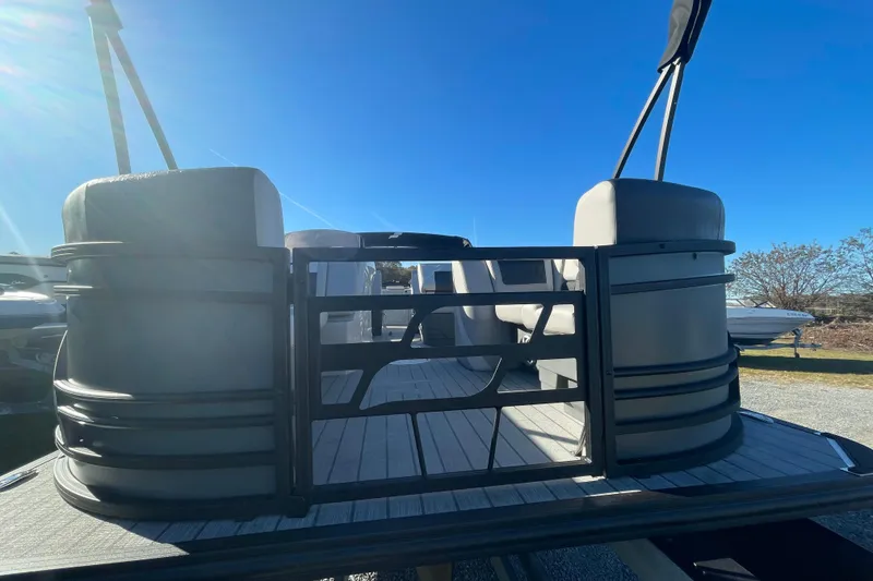 The Image of 2026 Starcraft SLS 3 RL pontoon boat under clear blue sky. - 0