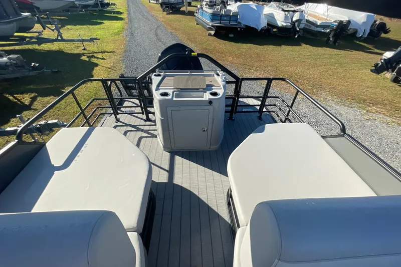 Slide: The Image of 2026 Starcraft SLS 3 RL pontoon boat interior with seating and console. - 23