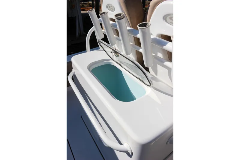 Slide: The Image of 2020 Sportsman Masters 267OE Bay Boat livewell with rod holders and open lid. - 10