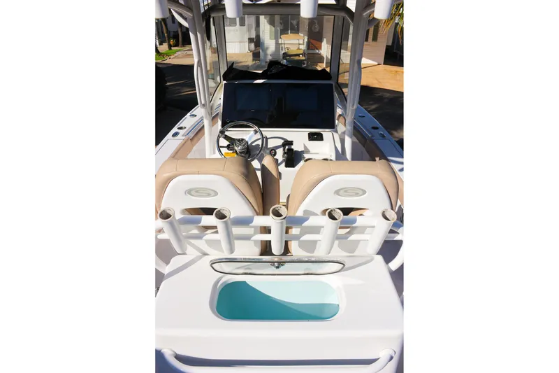 Slide: The Image of 2020 Sportsman Masters 267OE Bay Boat interior with helm, seating, and rod holders. - 11