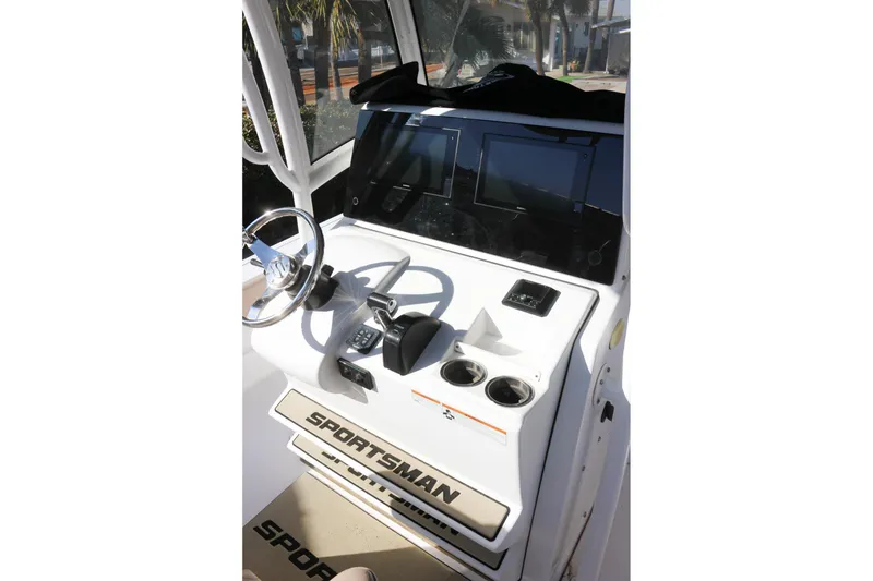 Slide: The Image of 2020 Sportsman Masters 267OE Bay Boat console with steering wheel and controls. - 13