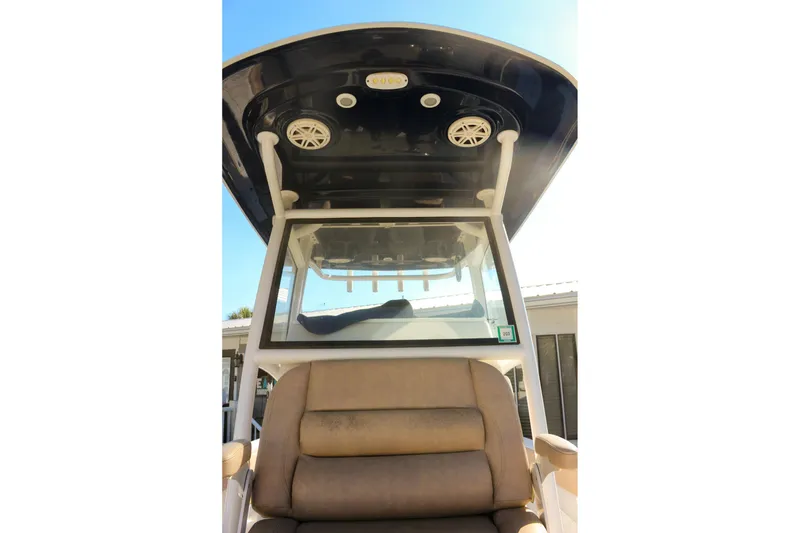 Slide: The Image of 2020 Sportsman Masters 267OE Bay Boat interior with seating and overhead speakers. - 18