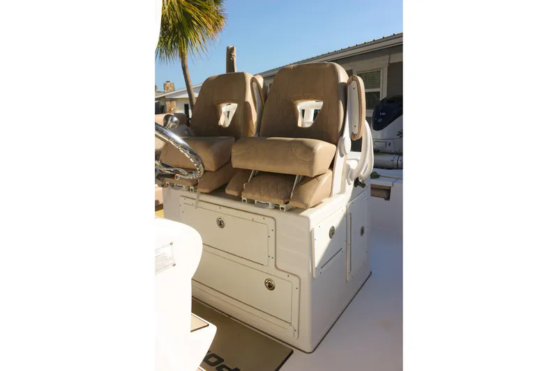 Slide: The Image of 2020 Sportsman Masters 267OE Bay Boat with dual tan seats and storage compartments. - 26