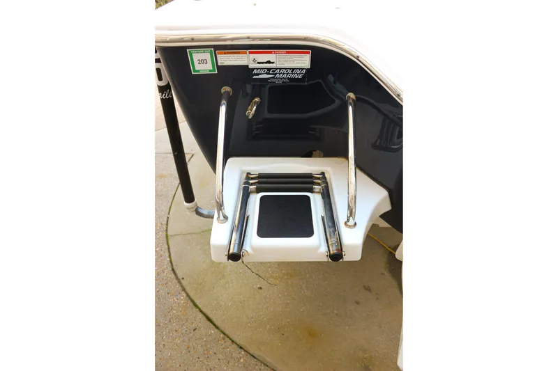 Slide: The Image of 2020 Sportsman Masters 267OE Bay Boat with foldable swim ladder and safety handles. - 28