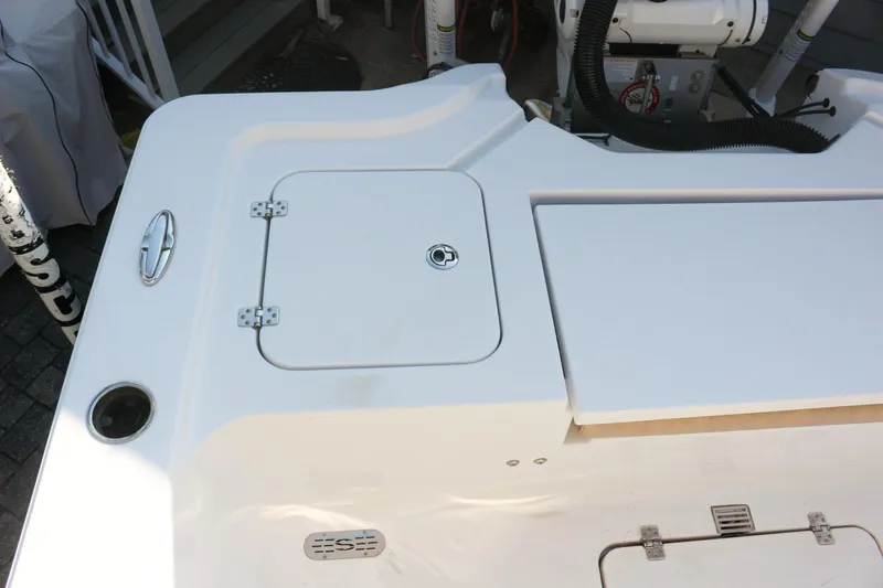 Slide: The Image of 2020 Sportsman Masters 267OE Bay Boat deck with storage hatch and fittings. - 4