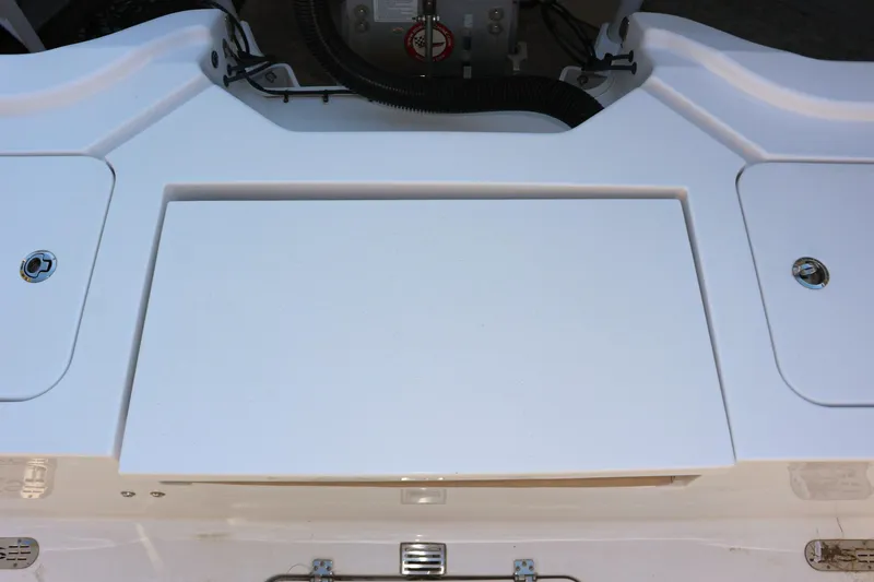 Slide: The Image of 2020 Sportsman Masters 267OE Bay Boat deck with storage compartments. - 5