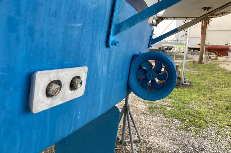 Slide: The Image of 1986 Heritage East Sundeck boat hull with blue paint and propeller detail. - 45