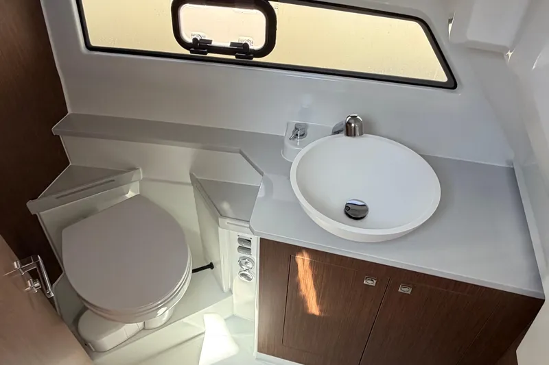 Slide: The Image of Modern bathroom in 2026 Beneteau Antares 9 boat with sink and toilet. - 23
