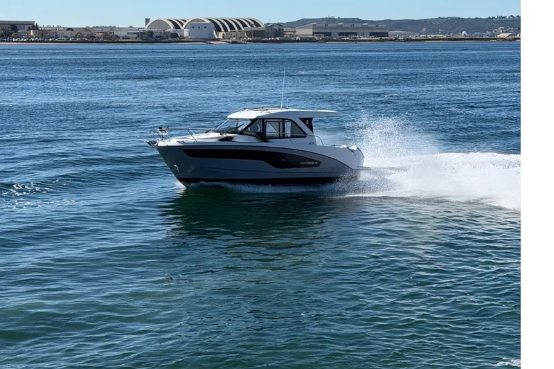 Slide: The Image of 2026 Beneteau Antares 9 cruising on open water, showcasing sleek design and performance. - 27
