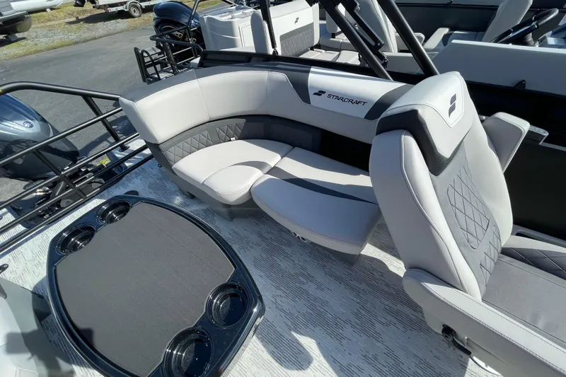 Slide: The Image of Luxurious seating on 2026 Starcraft SLS 1 boat with modern design and cup holders. - 10