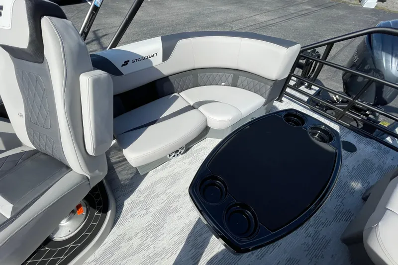 Slide: The Image of Luxurious seating and table on 2026 Starcraft SLS 1 boat, featuring modern design and comfort. - 11