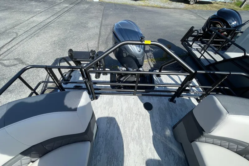 Slide: The Image of 2026 Starcraft SLS 1 boat interior with seating and motor, featuring sleek design and railing. - 12