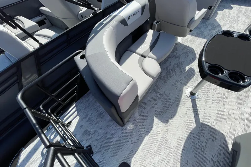 Slide: The Image of 2026 Starcraft SLS 1 boat interior with gray seating and a black table. - 13