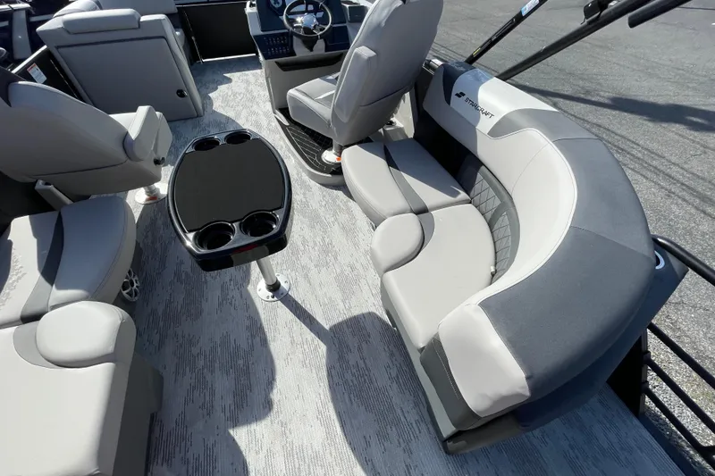 Slide: The Image of 2026 Starcraft SLS 1 boat interior with gray seating and a central table. - 14