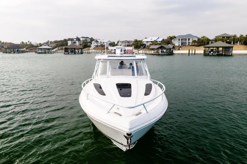 Slide: The Image of 2020 Intrepid 407 Cuddy cruising on a scenic waterway near urban skyline. - 12