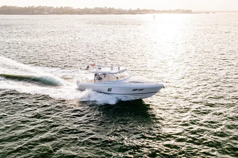 Slide: The Image of Aerial view of 2020 Intrepid 407 Cuddy cruising on open water. - 18