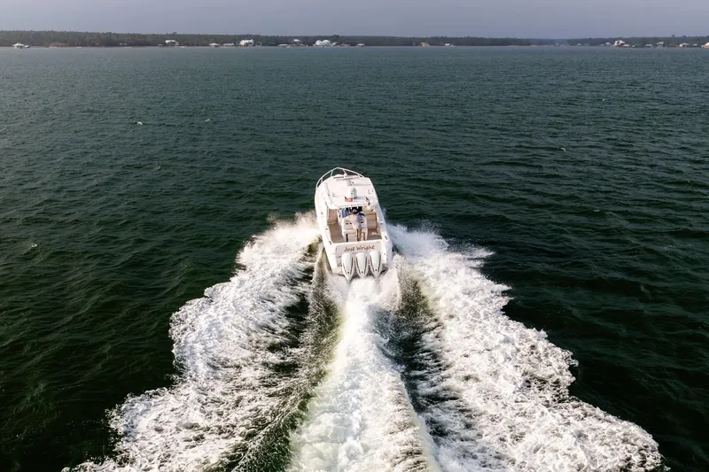 Slide: The Image of 2020 Intrepid 407 Cuddy cruising on open water, leaving a wake behind. - 21