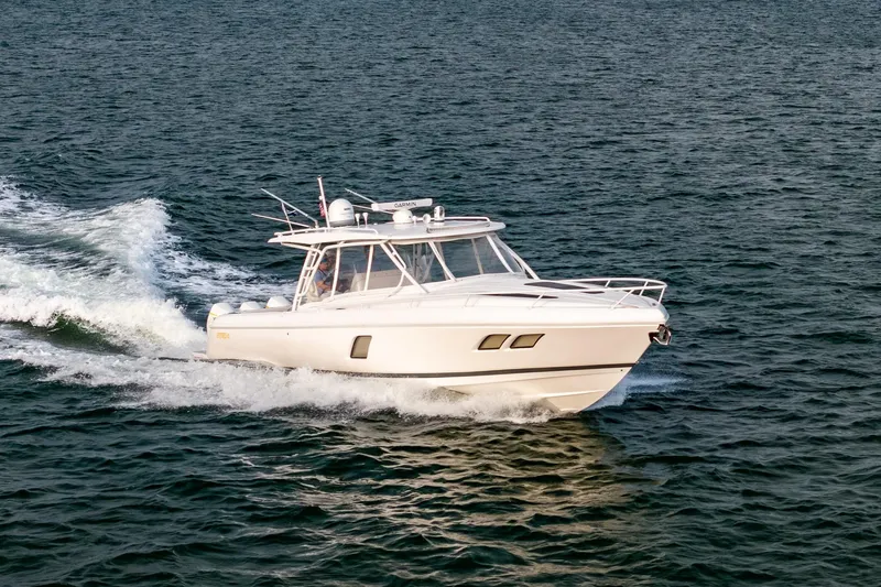 Slide: The Image of 2020 Intrepid 407 Cuddy cruising on open water, side view. - 27