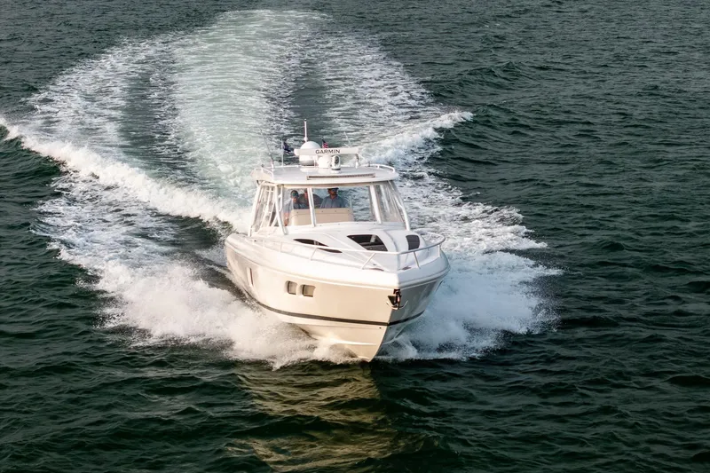 Slide: The Image of 2020 Intrepid 407 Cuddy cruising on open water. - 28