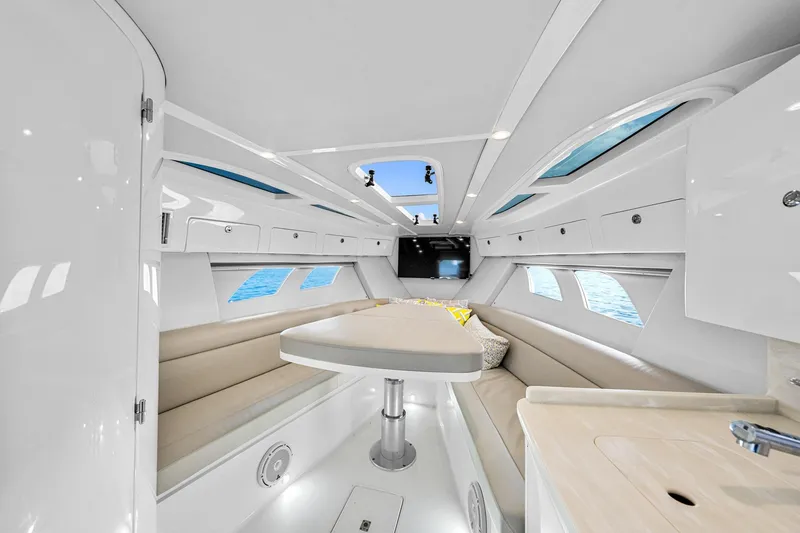 Slide: The Image of Luxurious interior of 2020 Intrepid 407 Cuddy boat with elegant seating and modern amenities. - 38