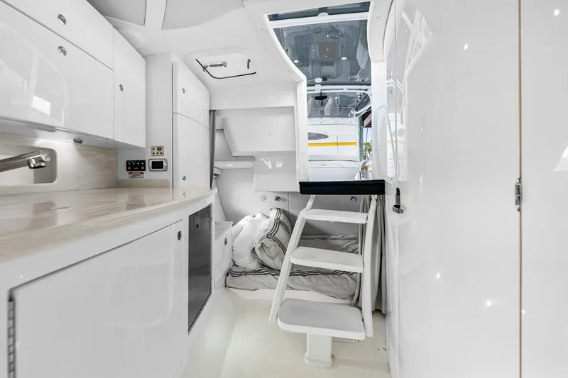 Slide: The Image of Luxurious interior of 2020 Intrepid 407 Cuddy boat with modern amenities and cozy sleeping area. - 47