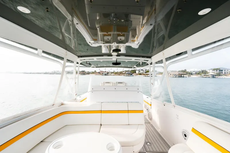 Slide: The Image of Interior view of 2020 Intrepid 407 Cuddy boat with white and yellow seating. - 52