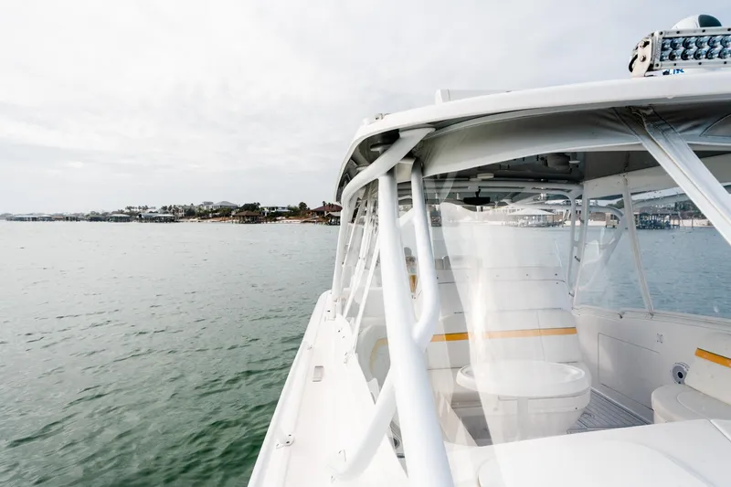 Slide: The Image of 2020 Intrepid 407 Cuddy cruising near coastal homes on a calm day. - 56